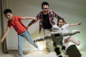 Family interacting with a robot, symbolizing how AI chatbots enhance business automation in 2025 — BotSimple.